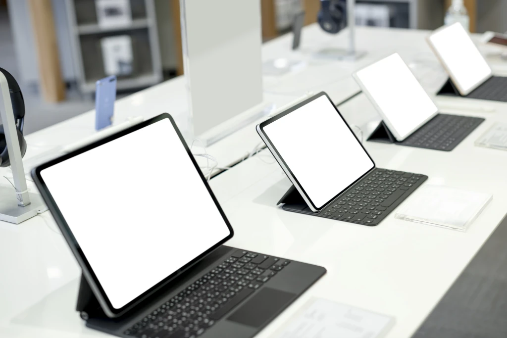 tablets-lined-up-display-shopping-mall.webp