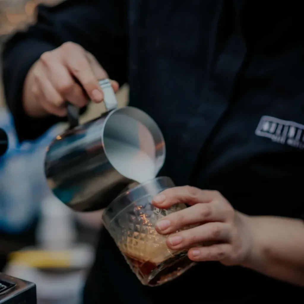 Friendly baristas serving delicious coffee to guests at an event in Mallorca.