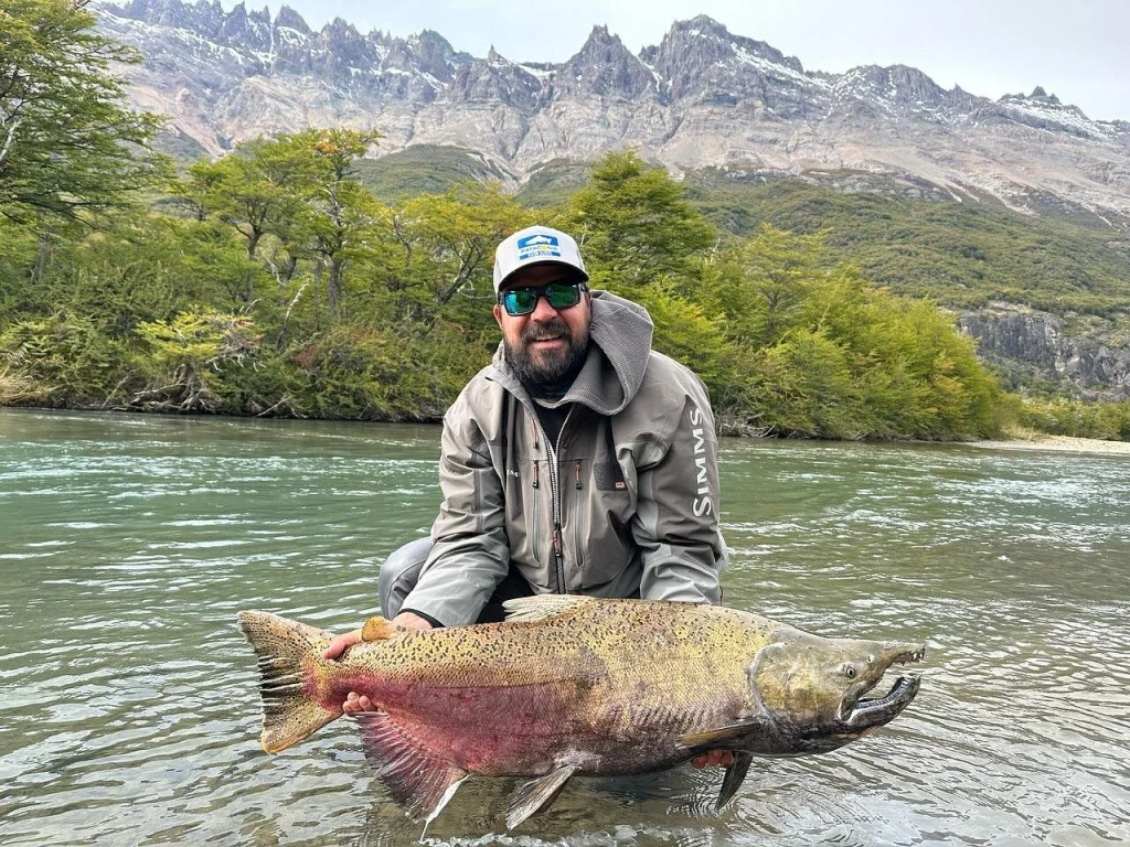 Tourist fishing for salmon in the Vueltas River, El Chaltén