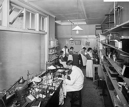 Men and women working in the inner room of the pathological department at The Royal London Homeopathic Hospital